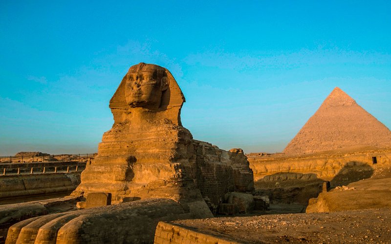 Tourist visiting the Pyramids of Giza and the Sphinx in Egypt
