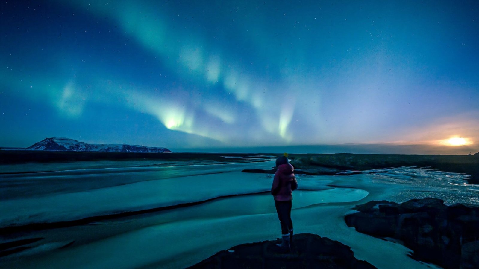 Woman relaxing in Blue Lagoon, solo travel in Iceland’s geothermal spa