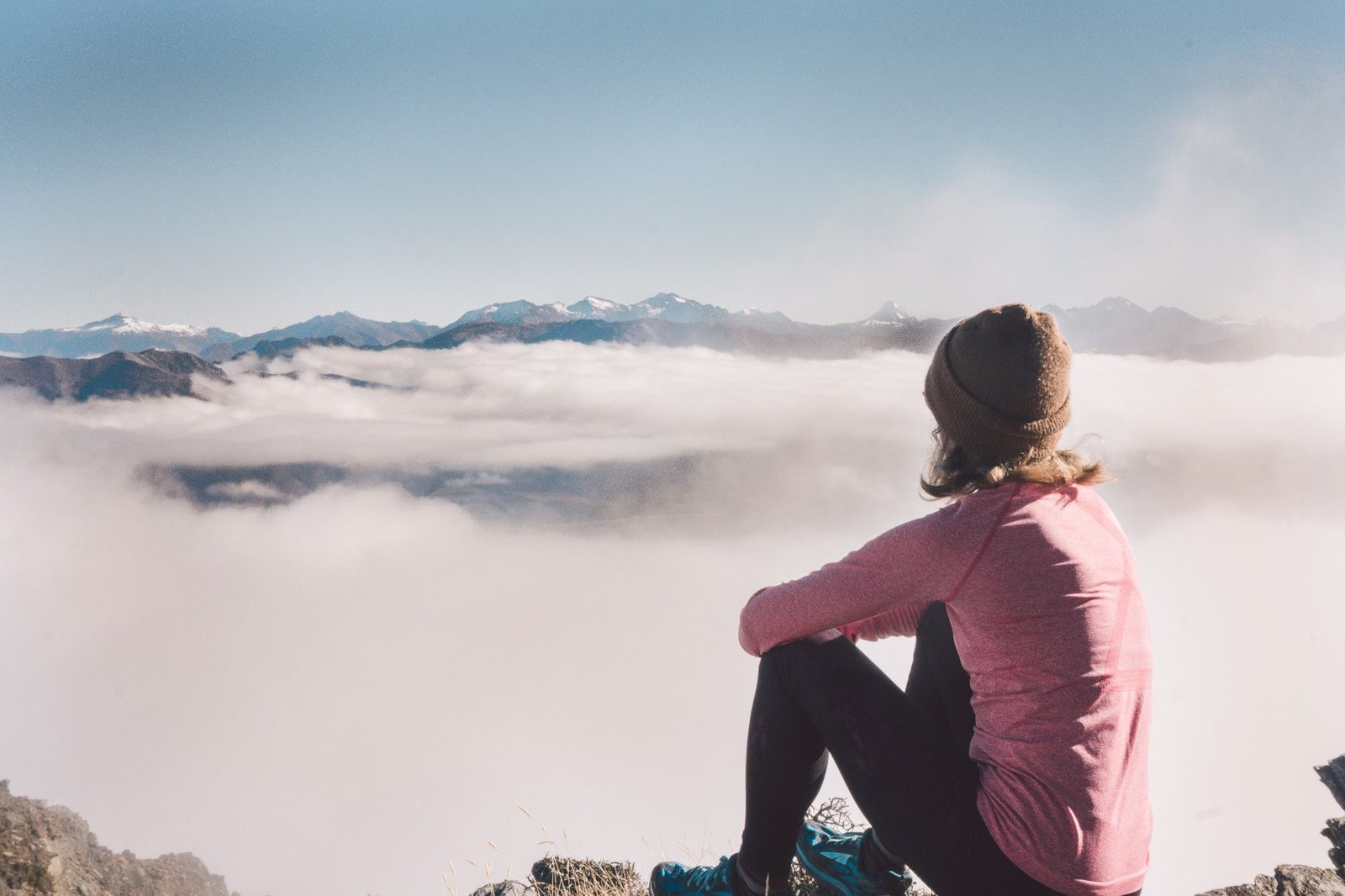 Adventurous woman hiking solo in Queenstown, New Zealand’s scenic trails