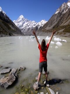 Confident solo female traveler backpacking in Iceland, embracing adventure and freedom