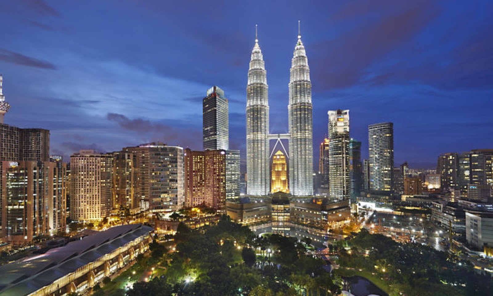 Traditional village surrounded by lush rainforest in Malaysia.