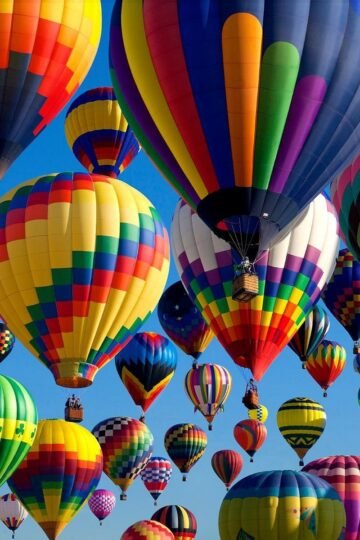 Colorful hot air balloons filling the sky at Albuquerque International Balloon Fiesta