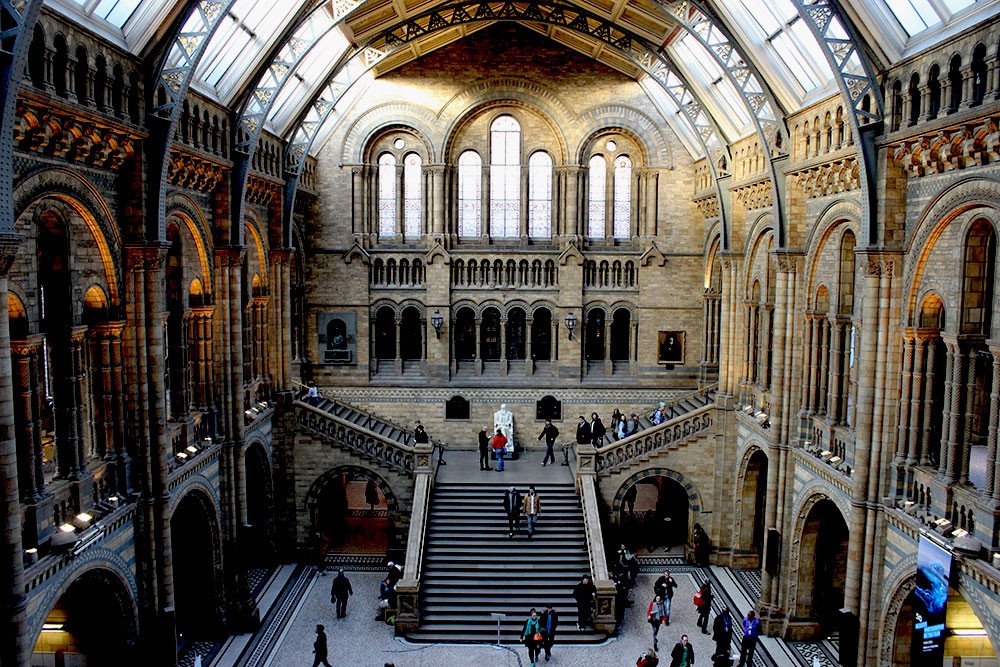 Family at Natural History Museum following 1 week London itinerary and travel guide with kids