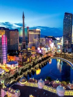 Colorful night view of the Las Vegas Strip with hotels and fountains, often seen before starting Las Vegas day trips