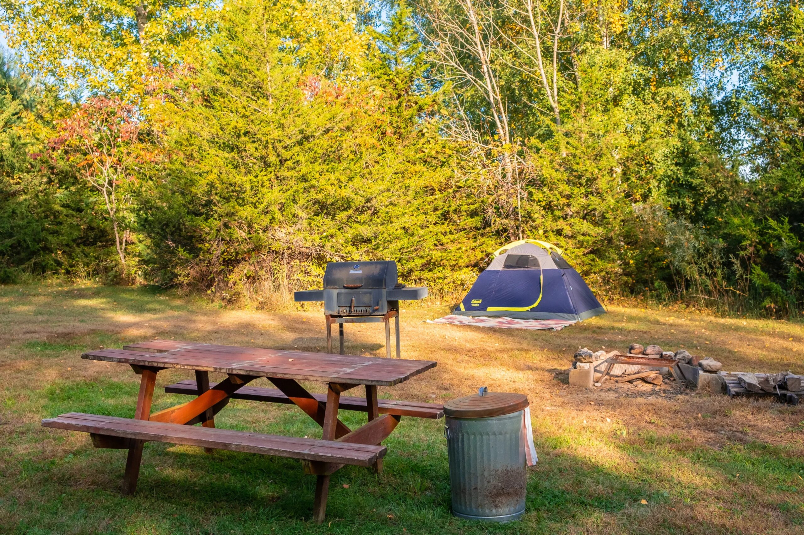 Scenic view of Vermont state park camping area with tents near the lake
