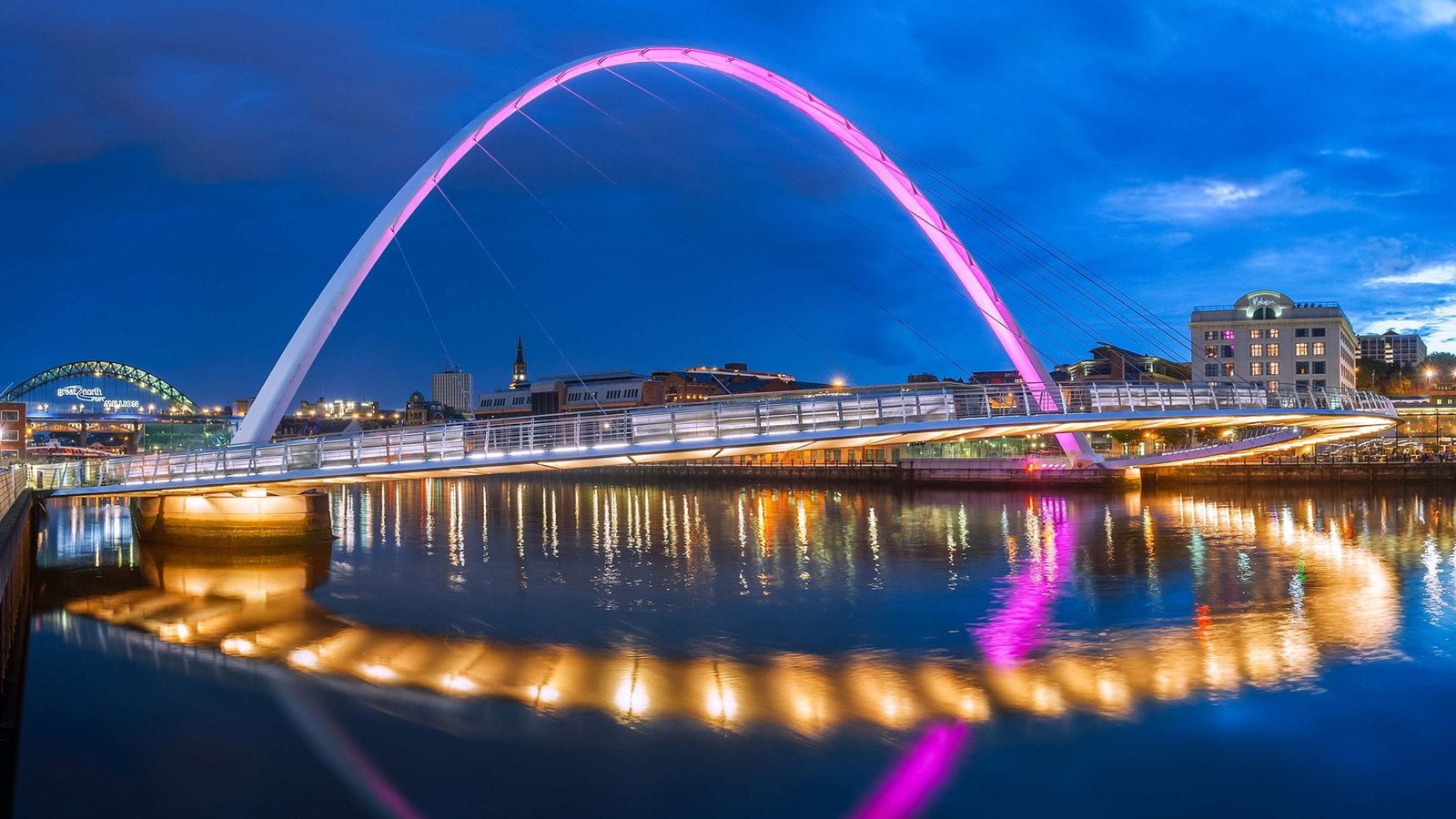 Cheapest flights to Newcastle city skyline view at sunset