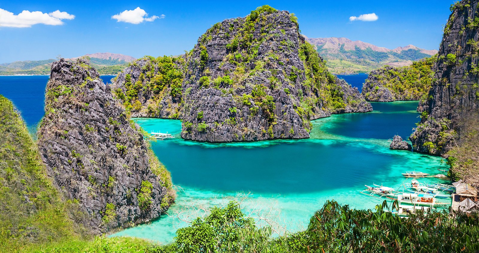 Travelers enjoying island hopping tour during 2 Weeks in Philippines Itinerary