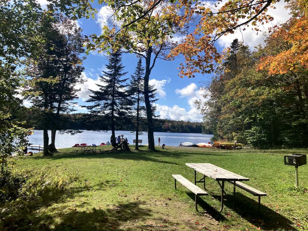 Family enjoying Vermont state park camping in the forest