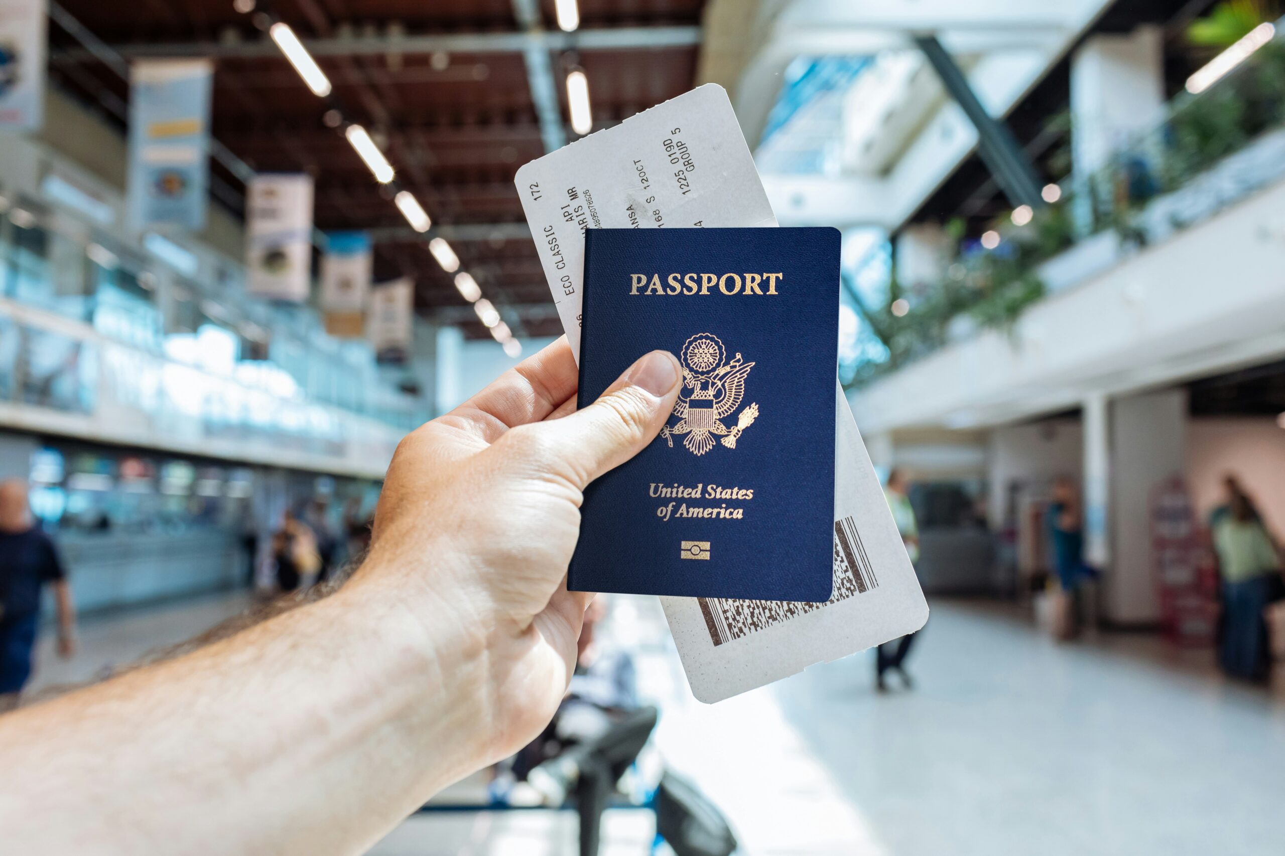 international travel insurance 2026 airport traveler passport plane